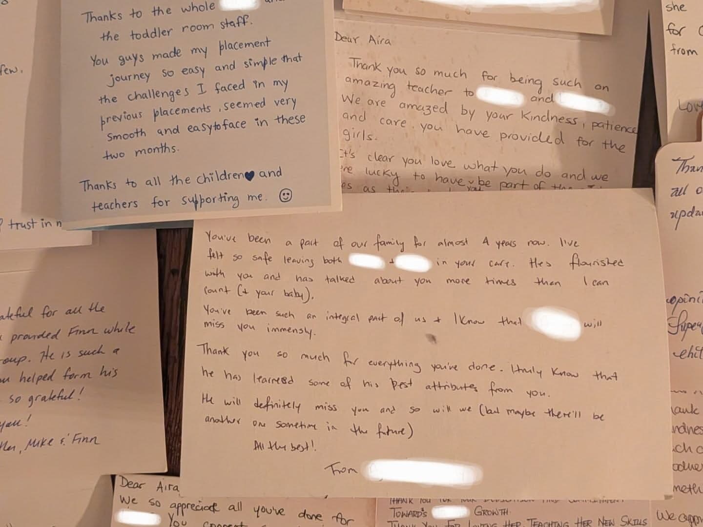 A stack of handwritten cards from families